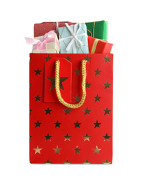Shopping paper bag with presents isolated on white