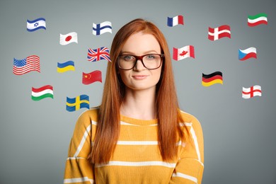 Portrait of interpreter and flags of different countries on grey background