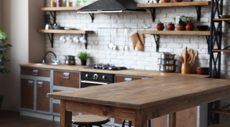 Empty wooden table in beautiful kitchen. Banner design