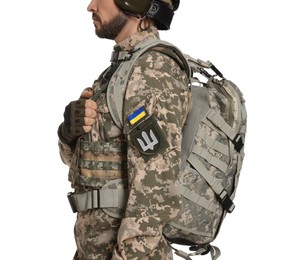 Soldier with Ukrainian flag and trident on military uniform against white background, closeup