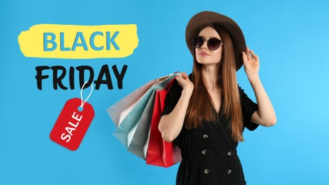Black Friday Sale. Beautiful young woman with shopping bags on light blue background
