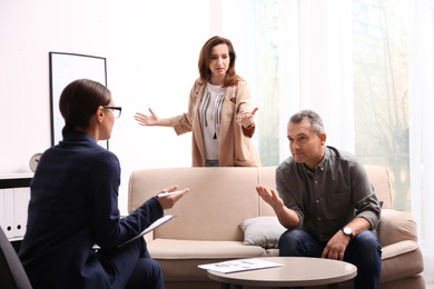Psychotherapist working with couple in office. Family counselling