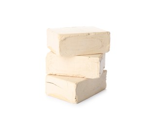 Blocks of compressed yeast on white background