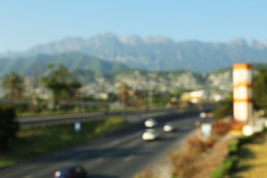 Blurred view of city and highway in mountains