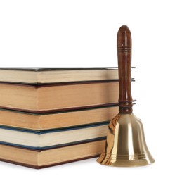 School bell with wooden handle and stack of books on white background