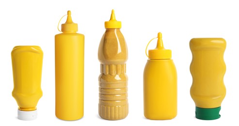 Image of Set with different plastic bottles of spicy mustard on white background. Banner design