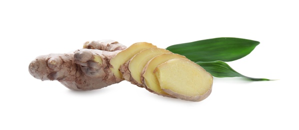 Photo of Cut fresh ginger and leaves isolated on white