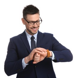 Happy businessman looking at wristwatch on white background. Time management