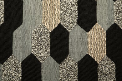 Carpet with geometric pattern as background, closeup