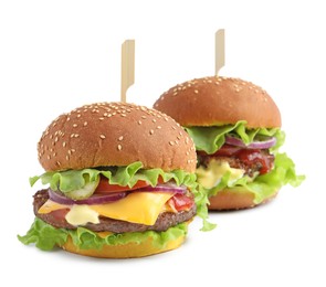 Photo of Delicious burgers with beef patty and lettuce isolated on white