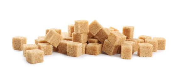 Pile of brown sugar cubes on white background