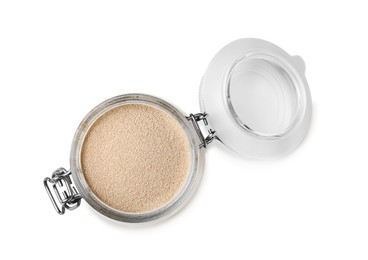 Photo of Granulated yeast in glass jar isolated on white, top view