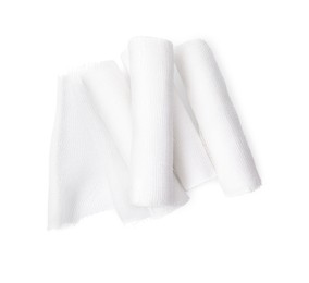 Medical bandage rolls on white background, top view