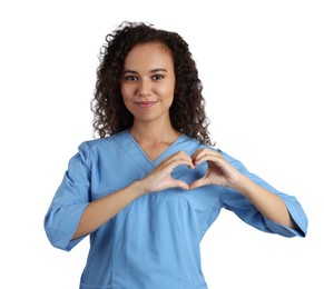 Photo of Happy young African-American doctor making heart with hands on white background