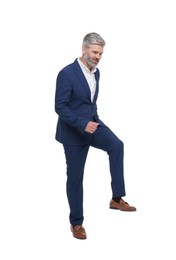 Photo of Mature businessman in stylish clothes posing on white background
