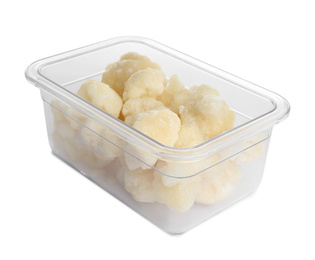 Frozen cauliflower florets in plastic container isolated on white. Vegetable preservation