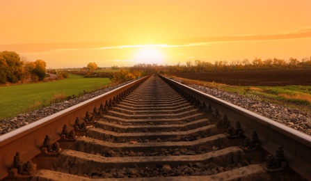 Photo of Railway line with track ballast in countryside. Train journey