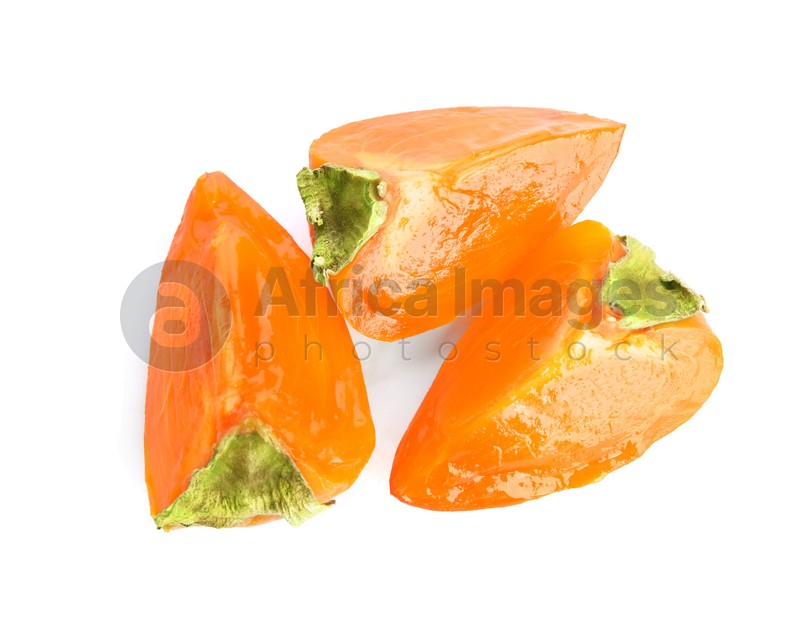 Slices of delicious persimmon isolated on white, top view