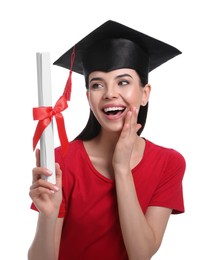 Emotional student with graduation hat and diploma on white background