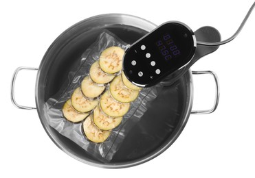 Photo of Thermal immersion circulator and vacuum packed eggplant in pot on white background, top view. Sous vide cooking