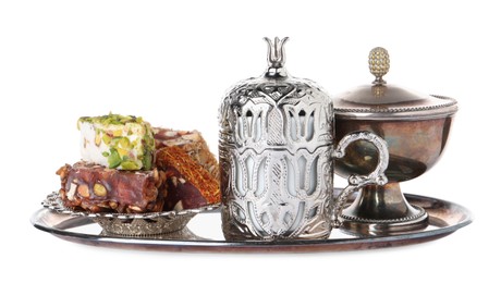 Photo of Tea and Turkish delight served in vintage tea set on white background