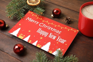 Greeting card, Christmas decor and cup of cocoa on wooden background, closeup