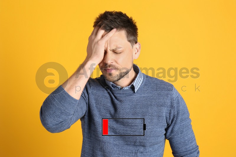 Illustration of discharged battery and tired man on orange background. Extreme fatigue