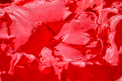 Delicious red fruit jelly as background, closeup