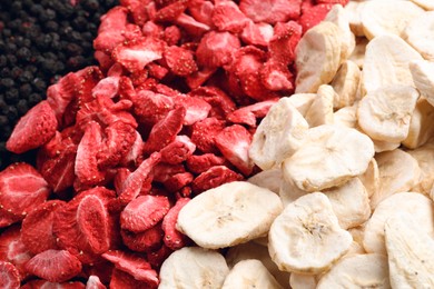 Closeup of freeze dried blueberries, strawberries and bananas as background