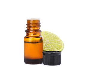 Bottle of citrus essential oil and cut fresh lime isolated on white