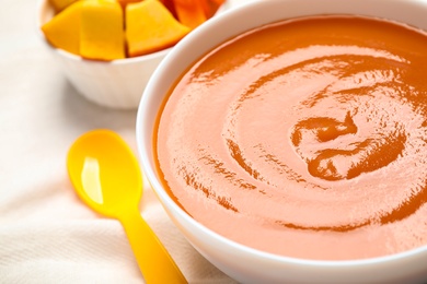 Healthy baby food in bowl, closeup view