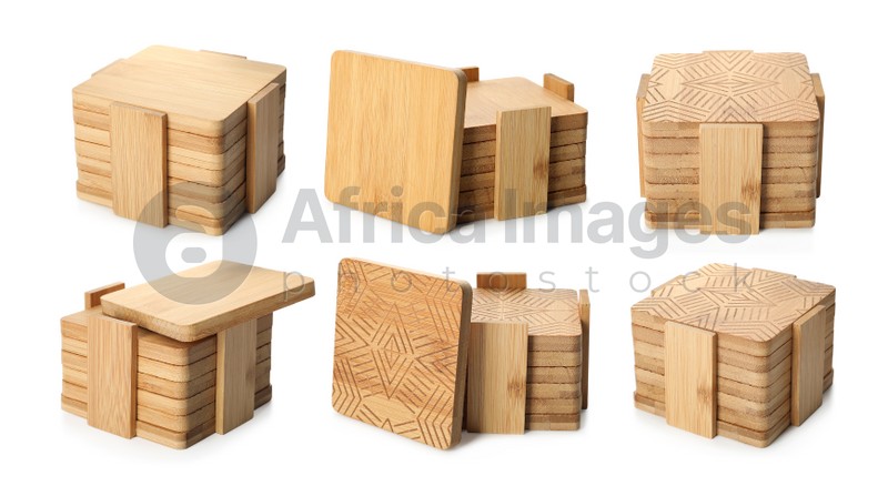 Set with stylish wooden cup coasters on white background 