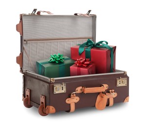 Beautiful gift boxes in retro suitcase on white background
