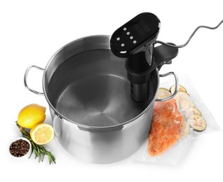 Thermal immersion circulator in pot and ingredients on white background. Sous vide cooking