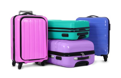Stylish suitcases packed for travel on white background 