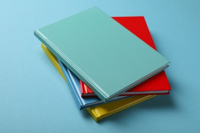 New colorful planners on light blue background