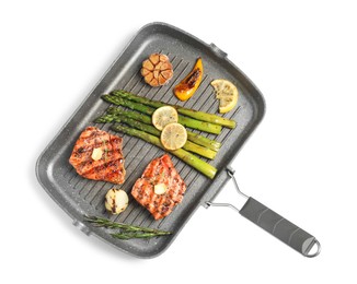 Frying pan with tasty grilled salmon, lemon and asparagus on white background, top view