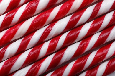 Top view of many sweet Christmas candy canes as background, closeup