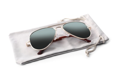 Photo of Stylish sunglasses with grey cloth bag on white background