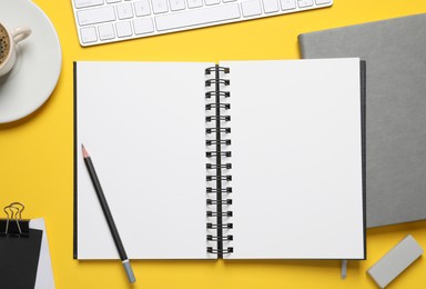 Photo of Flat lay composition with stylish notebooks on yellow background