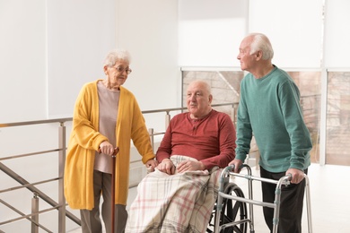 Photo of Group of happy senior people in hospital