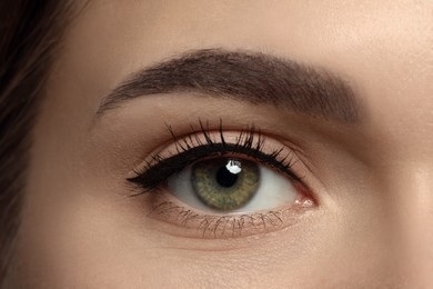 Photo of Young woman with permanent makeup of eyes and brows, closeup