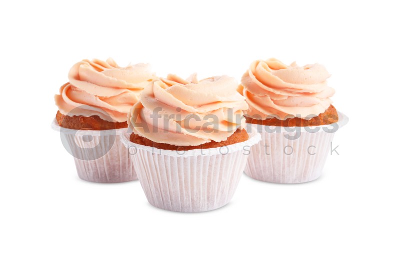Photo of Tasty cupcakes with cream isolated on white