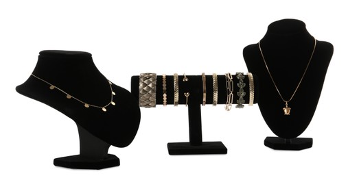 Photo of Different display stands with stylish jewelry on white background