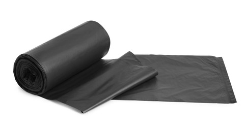 Roll of black garbage bags on white background. Cleaning supplies