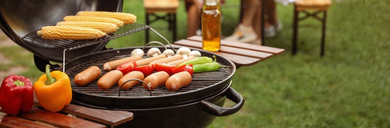 Barbecue grill with tasty fresh food outdoors, space for text. Banner design