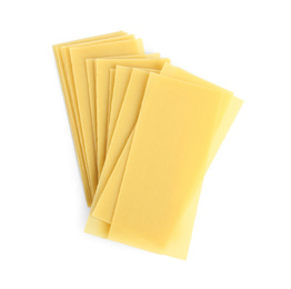 Uncooked lasagna sheets on white background, top view