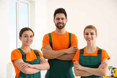 Team of professional janitors indoors. Cleaning service