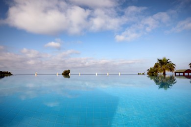 Beautiful landscape with blue sky and infinity pool at resort