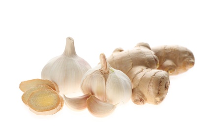 Ginger and fresh garlic on white background. Natural cold remedies